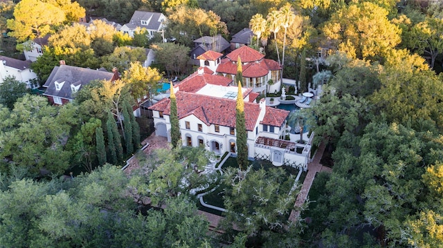 birds eye view of property with a forest view