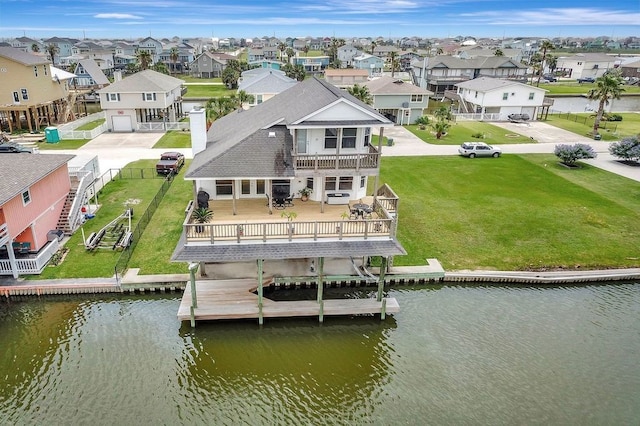 exterior space featuring a water view and a lawn