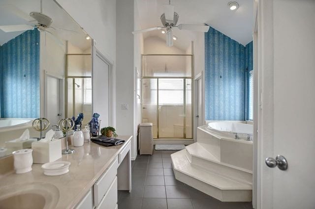 bathroom featuring double vanity, separate shower and tub, tile flooring, and ceiling fan