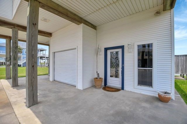 exterior space with a garage and a patio area