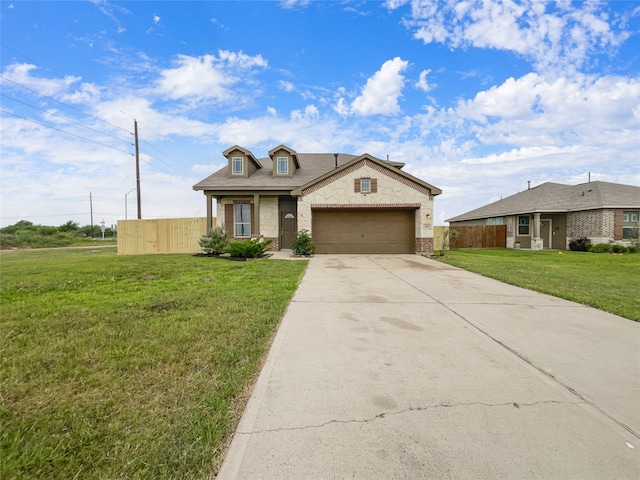 view of front facade with a front yard and a garage