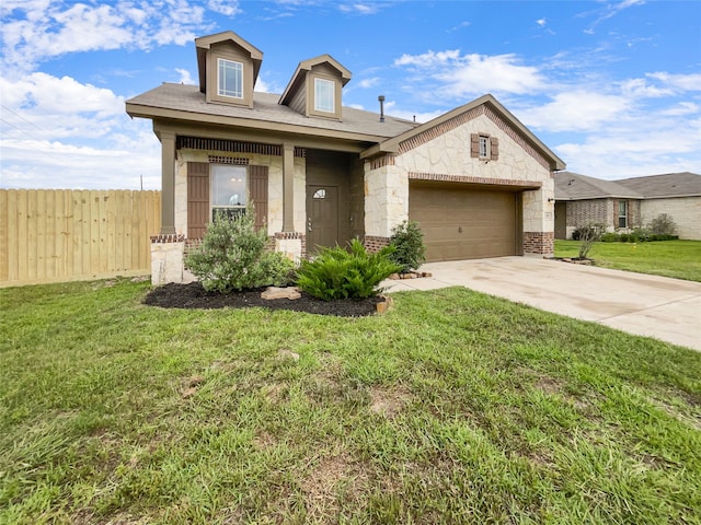 view of front of property with a garage and a front lawn