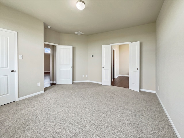 unfurnished bedroom featuring carpet floors