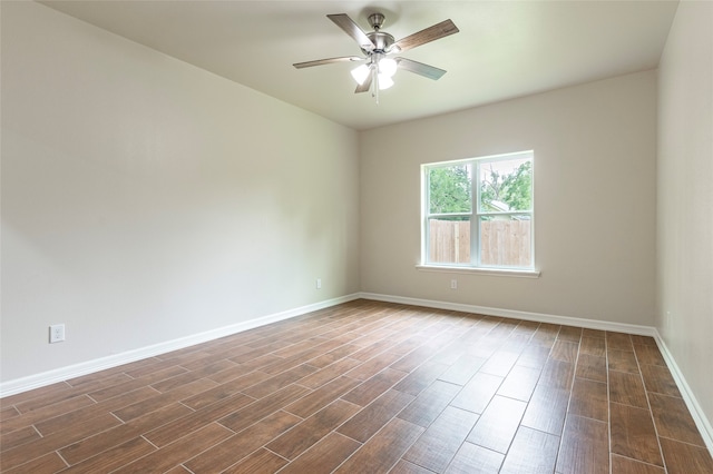 empty room featuring dark hardwood / wood-style floors and ceiling fan