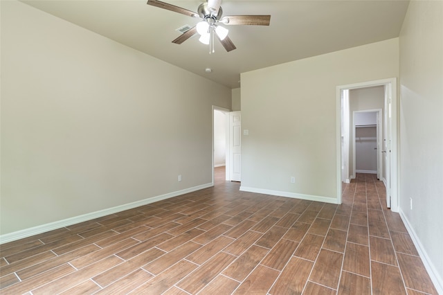 empty room with wood-type flooring and ceiling fan