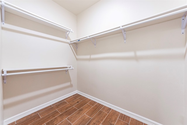 spacious closet featuring hardwood / wood-style floors