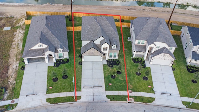 birds eye view of property featuring a water view