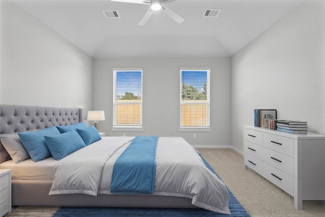 carpeted bedroom featuring vaulted ceiling and ceiling fan