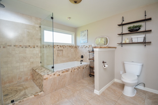 bathroom featuring tile floors, toilet, and independent shower and bath