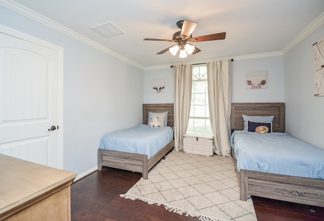 bedroom featuring ornamental molding, wood-type flooring, and ceiling fan