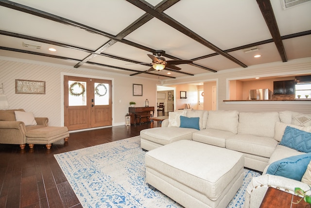 living room with beamed ceiling, coffered ceiling, dark hardwood / wood-style floors, and ceiling fan