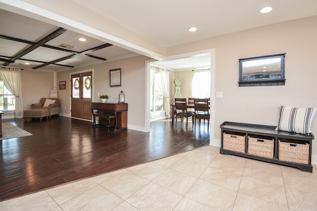 interior space featuring light hardwood / wood-style floors, a wealth of natural light, and coffered ceiling