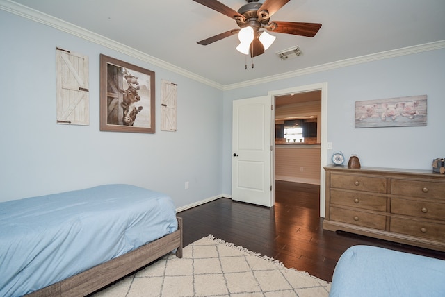 bedroom featuring ceiling fan, ornamental molding, and wood-type flooring