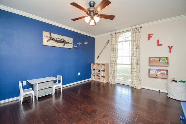 interior space featuring a healthy amount of sunlight, dark hardwood / wood-style flooring, ornamental molding, and ceiling fan