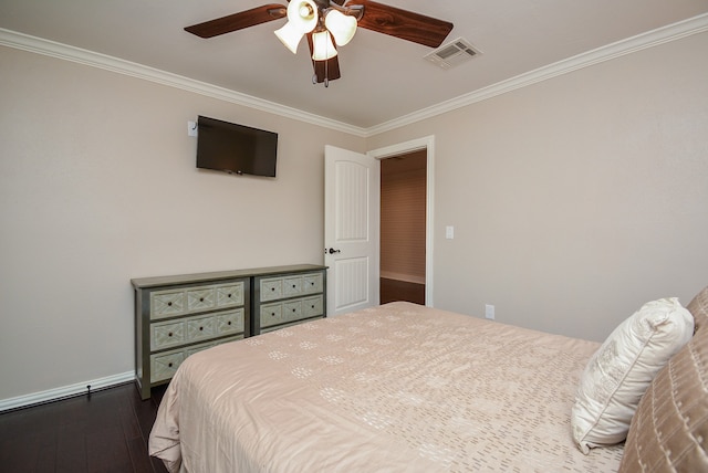 bedroom with crown molding, ceiling fan, and dark hardwood / wood-style flooring