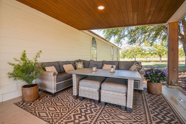 view of terrace with outdoor lounge area and a wooden deck