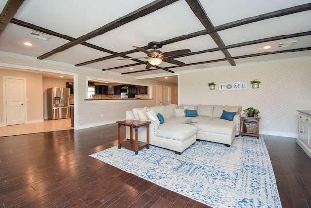 living room with beam ceiling, hardwood / wood-style floors, and ceiling fan