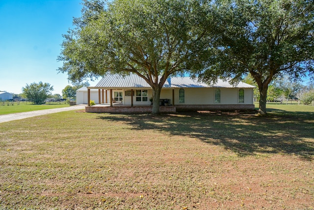 ranch-style house featuring a front lawn