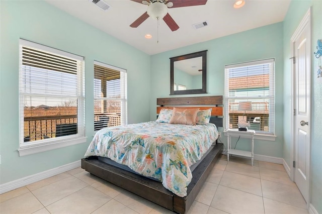 bedroom with ceiling fan and light tile flooring