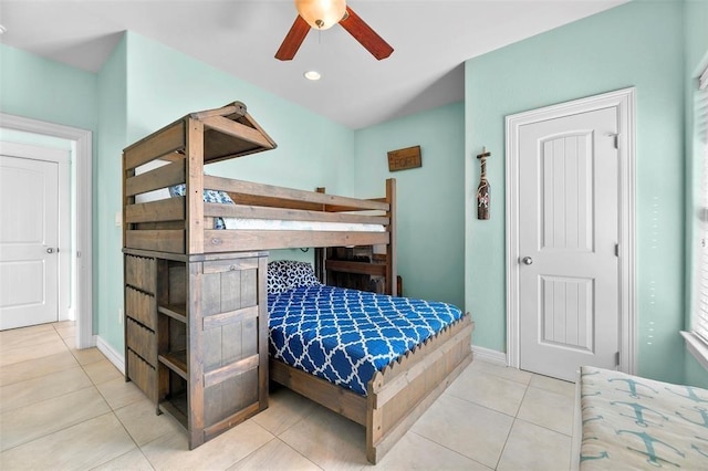 tiled bedroom with ceiling fan