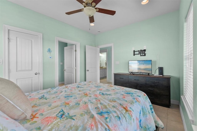 bedroom with ceiling fan and light tile floors