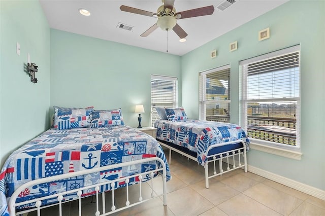 bedroom featuring tile floors and ceiling fan