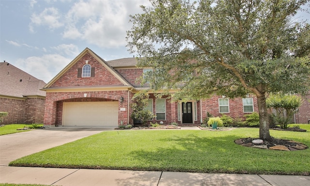 view of front facade with a garage and a front yard