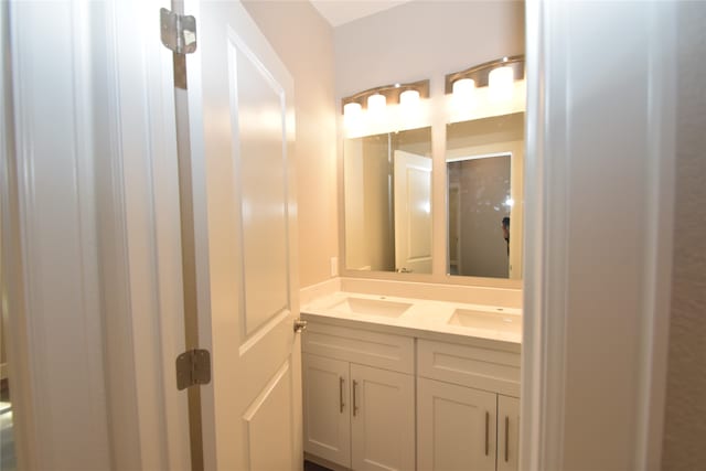 bathroom with dual bowl vanity