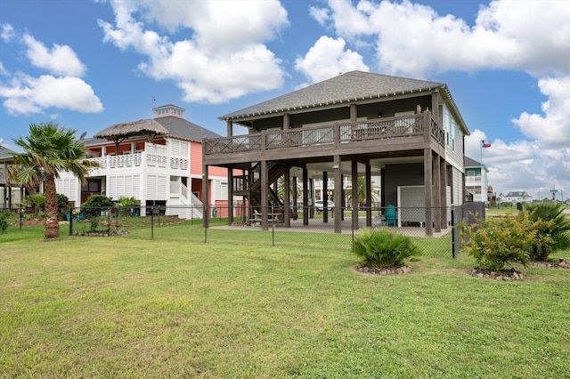 rear view of house with a lawn