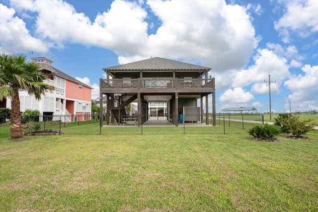 back of property featuring a patio area and a lawn