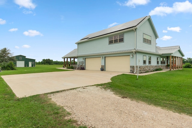 view of property exterior with solar panels, a lawn, and a garage