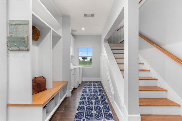 mudroom featuring dark wood-type flooring