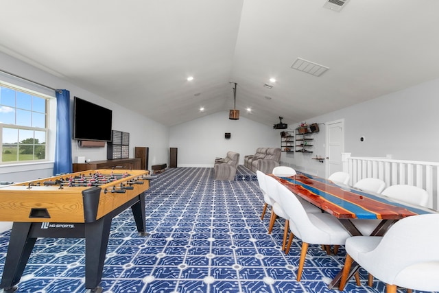 recreation room featuring vaulted ceiling