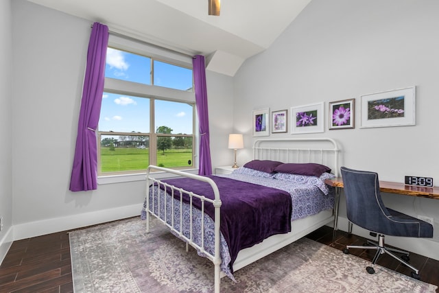 bedroom featuring ceiling fan, high vaulted ceiling, and hardwood / wood-style flooring