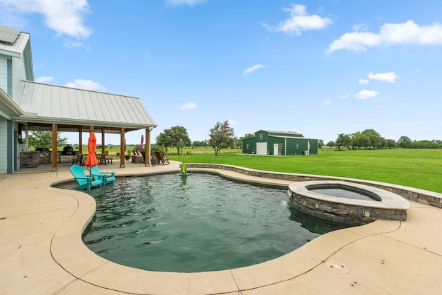 view of pool featuring an in ground hot tub, a gazebo, a patio area, and a lawn