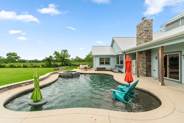 view of swimming pool with a lawn, a patio area, and an in ground hot tub