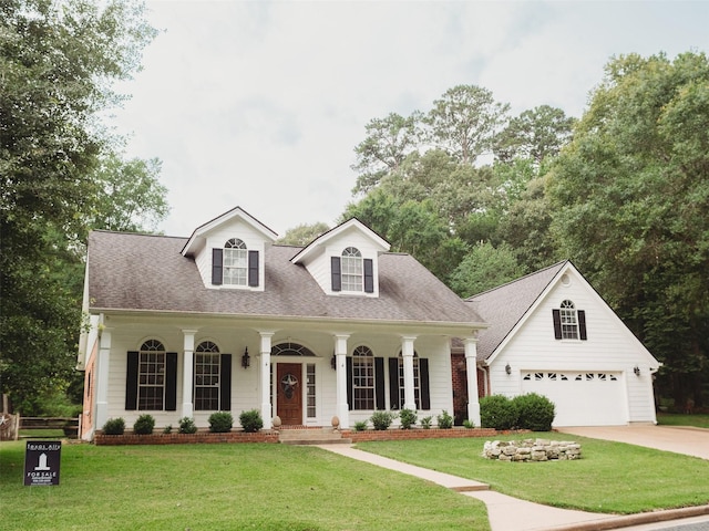 cape cod home featuring covered porch and a front lawn