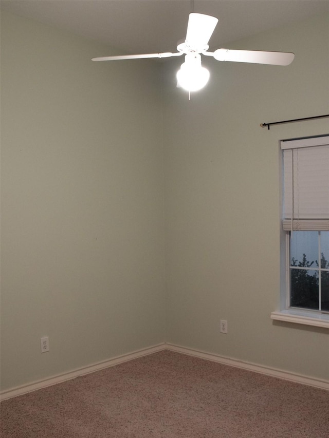 unfurnished room with carpet and ceiling fan