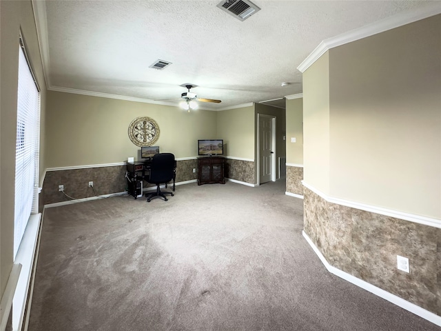 unfurnished office with a textured ceiling, carpet, ceiling fan, and crown molding