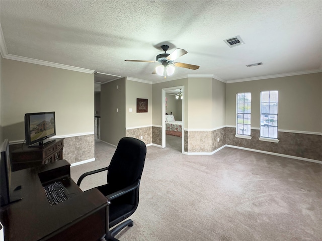 carpeted office with ornamental molding, ceiling fan, and a textured ceiling