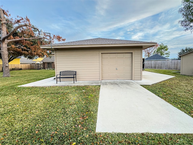 garage with a lawn