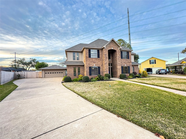 view of front of property with a front lawn and a garage