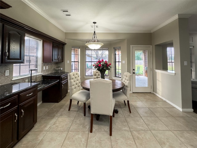 tiled dining space with ornamental molding