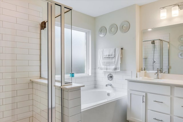 bathroom featuring vanity and separate shower and tub