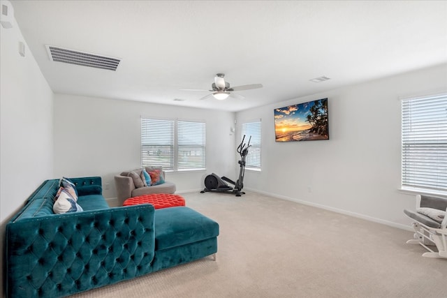 interior space with ceiling fan and carpet floors