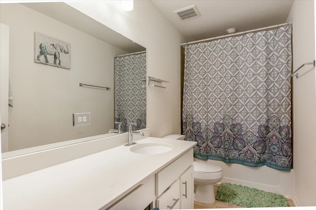 full bathroom featuring vanity, toilet, and shower / tub combo with curtain