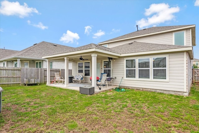 back of house with a lawn, ceiling fan, and a patio