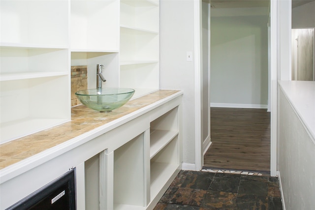 interior space featuring sink and dark hardwood / wood-style flooring