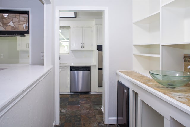 kitchen with dishwasher and white cabinetry