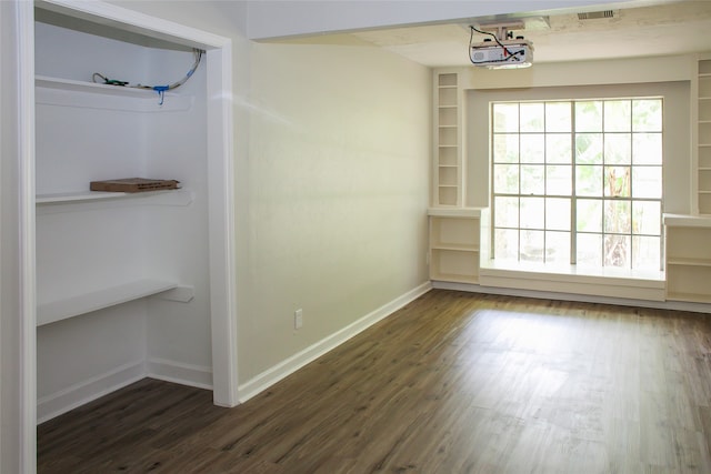 spare room with dark hardwood / wood-style floors